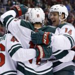 Minnesota Wild left wing Zach Parise (11) celebrates his goal against the Arizona Coyotes with center Joel Eriksson Ek (14) and defenseman Jared Spurgeon (46) during the first period of an NHL hockey game Thursday, March 1, 2018, in Glendale, Ariz. (AP Photo/Ross D. Franklin)