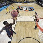 Loyola-Chicago's Donte Ingram (0) shoots the ball during the first half in the semifinals of the Final Four NCAA college basketball tournament against Michigan, Saturday, March 31, 2018, in San Antonio. (AP Photo/Chris Steppig, NCAA Photos Pool)