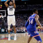 Villanova guard Mikal Bridges shoots a 3-point basket in front of Kansas guard Malik Newman, right, during the second half in the semifinals of the Final Four NCAA college basketball tournament, Saturday, March 31, 2018, in San Antonio. (AP Photo/David J. Phillip)