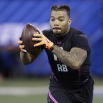 FILE - In this Friday, March 2, 2018, file photo, LSU running back Derrius Guice runs a drill during the NFL football scouting combine in Indianapolis. The NFL is investigating whether questions asked to Guice at the combine were inappropriate. Guice, projected as one of the top running backs in this draft, told Sirius XM Radio that one team asked if he was gay and another club asked if his mother "sells herself."   While not confirming that it had evidence yet that such questions were asked of Guice, the league released a statement Thursday, March 8, 2018, deploring any such queries. (AP Photo/Darron Cummings, File)
