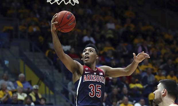Arizona's Allonzo Trier (35) lays upa a shot against California in the second half of an NCAA colle...
