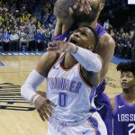 Phoenix Suns center Tyson Chandler, top, and Oklahoma City Thunder guard Russell Westbrook (0) watch Westbrook's shot during the second half of an NBA basketball game in Oklahoma City, Thursday, March 8, 2018. (AP Photo/Sue Ogrocki)