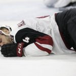 Arizona Coyotes' Niklas Hjalmarsson (4), of Sweden, lies on the ice following an injury during the second period of the team's NHL hockey game against the Carolina Hurricanes in Raleigh, N.C., Thursday, March 22, 2018. (AP Photo/Gerry Broome)