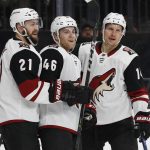 Players celebrate after Arizona Coyotes right wing Richard Panik, right, scored against the Vegas Golden Knights during the first period of an NHL hockey game, Wednesday, March 28, 2018, in Las Vegas. (AP Photo/John Locher)