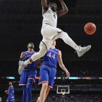 Villanova's Eric Paschall (4) dunks during the second half in the semifinals of the Final Four NCAA college basketball tournament against Kansas, Saturday, March 31, 2018, in San Antonio. (AP Photo/Chris Steppig, NCAA Photos Pool)