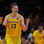 Michigan's Moritz Wagner (13) reacts after scoring a 3-point shot against Loyola-Chicago during the second half in the semifinals of the Final Four NCAA college basketball tournament, Saturday, March 31, 2018, in San Antonio. (AP Photo/Charlie Neibergall)