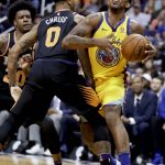 Golden State Warriors guard Nick Young, right, is fouled by Phoenix Suns forward Marquese Chriss during the first half of an NBA basketball game in Phoenix, Saturday, March 17, 2018. (AP Photo/Chris Carlson)