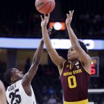 Arizona State's Tra Holder shoots covered by Colorado's McKinley Wright IV during the first half of an NCAA college basketball game in the first round of the Pac-12 men's tournament Wednesday, March 7, 2018, in Las Vegas. (AP Photo/Isaac Brekken)