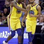 Golden State Warriors guard Quinn Cook, right, celebrates with guard Quinn Cook during the second half of the team's NBA basketball game against the Phoenix Suns in Phoenix, Saturday, March 17, 2018. (AP Photo/Chris Carlson)