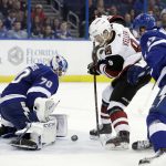 Arizona Coyotes center Clayton Keller (9) shoots against Tampa Bay Lightning goaltender Louis Domingue (70) during the third period of an NHL hockey game Monday, March 26, 2018, in Tampa, Fla. (AP Photo/Chris O'Meara)