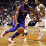 Detroit Pistons center Andre Drummond, left, drives on Phoenix Suns forward Marquese Chriss during the first half of an NBA basketball game Tuesday, March 20, 2018, in Phoenix. (AP Photo/Matt York)