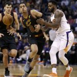 Cleveland Cavaliers guard Jordan Clarkson (8) drives on Phoenix Suns guard Troy Daniels in the first half during an NBA basketball game, Tuesday, March 13, 2018, in Phoenix. (AP Photo/Rick Scuteri)