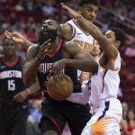 Houston Rockets guard James Harden (13) is fouled by Phoenix Suns guard Tyler Ulis (8) in the first half of an NBA basketball game Friday, March 30, 2018, in Houston. (AP Photo/George Bridges)