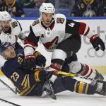 Buffalo Sabres' Sam Reinhart (23) and Arizona Coyotes Niklas Hjalmarsson (4) collide during the third period of an NHL hockey game Wednesday, March 21, 2018, in Buffalo, N.Y. (AP Photo/Jeffrey T. Barnes)