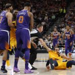 Phoenix Suns' Jared Dudley (3) and Marquese Chriss (0) stand nearby after shoving Utah Jazz's Ricky Rubio, right, to the court during the second of an NBA basketball game Thursday, March 15, 2018, in Salt Lake City. Dudley and Chriss were ejected with a flagrant 2 fouls. (AP Photo/Rick Bowmer)