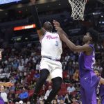 Miami Heat's Dwyane Wade (3) shoots over Phoenix Suns' Josh Jackson during the second half of an NBA basketball game, Monday, March 5, 2018, in Miami. (AP Photo/Lynne Sladky)