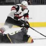 Vegas Golden Knights defenseman Colin Miller slides to try to block a shot by Arizona Coyotes center Brad Richardson during the first period of an NHL hockey game, Wednesday, March 28, 2018, in Las Vegas. (AP Photo/John Locher)