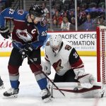 Arizona Coyotes goaltender Darcy Kuemper, right, makes a pad save of a redirected shot by Colorado Avalanche left wing Gabriel Landeskog in the first period of an NHL hockey game Saturday, March 10, 2018, in Denver. (AP Photo/David Zalubowski)