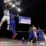Villanova's Eric Paschall (4) goes up for a shot against Kansas's Udoka Azubuike (35) during the second half in the semifinals of the Final Four NCAA college basketball tournament, Saturday, March 31, 2018, in San Antonio. (AP Photo/David J. Phillip)