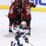 Minnesota Wild center Mikko Koivu (9) pauses on the ice as Arizona Coyotes defenseman Jakob Chychrun (6) celebrates his goal with left wing Max Domi (16), right wing Christian Fischer (36) and center Clayton Keller (9) during the second period of an NHL hockey game Thursday, March 1, 2018, in Glendale, Ariz. (AP Photo/Ross D. Franklin)