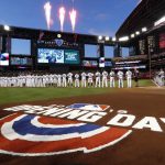 The Arizona Diamondbacks and the Colorado Rockies line up during the national anthem prior to their opening day baseball game Thursday, March 29, 2018, in Phoenix. (AP Photo/Matt York)