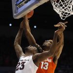 Syracuse's Paschal Chukwu (13) blocks a shot by Arizona State's Romello White (23) during the first half of a First Four game of the NCAA men's college basketball tournament Wednesday, March 14, 2018, in Dayton, Ohio. (AP Photo/John Minchillo)a
