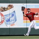 Arizona Diamondbacks right fielder David Peralta catches a fly ball hit by Cincinnati Reds' Joey Votto during the third inning of a spring training baseball game in Scottsdale, Ariz., Wednesday, March 14, 2018. (AP Photo/Chris Carlson)