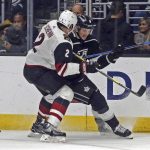Arizona Coyotes defenseman Luke Schenn (2) and Los Angeles Kings left winger Adrian Kempe (9) tangle during the second period of an NHL hockey game in Los Angeles on Thursday, March 29, 2018. (AP Photo/Reed Saxon)