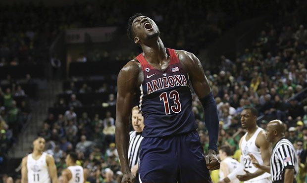 Arizona's DeAndre Ayton celebrates during the second half against Oregon in an NCAA college basketb...