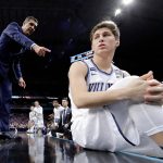 Villanova head coach Jay Wright talks to guard Collin Gillespie during the second half against Kansas in the semifinals of the Final Four NCAA college basketball tournament, Saturday, March 31, 2018, in San Antonio. (AP Photo/David J. Phillip)