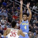 UCLA's Jaylen Hands (4) shoots over Arizona's Allonzo Trier (35) during the first half of an NCAA college basketball game in the semifinals of the Pac-12 men's tournament Friday, March 9, 2018, in Las Vegas. (AP Photo/Isaac Brekken)
