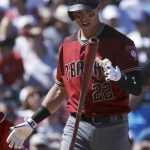 Arizona Diamondbacks' Jake Lamb reacts after a strike during the third inning of the team's spring training baseball game against the Los Angeles Angels in Tempe, Ariz., Tuesday, March 20, 2018. (AP Photo/Chris Carlson)