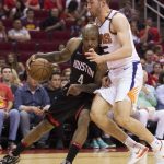 Houston Rockets forward PJ Tucker (4) tries to drive against Phoenix Suns forward Alec Peters (25) in the first half of an NBA basketball game Friday, March 30, 2018, in Houston. (AP Photo/George Bridges)