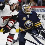 Buffalo Sabres goalie Linus Ullmark (35) and Arizona Coyotes forward Jordan Martinook (48) watch the puck go wide of the goal during the second period of an NHL hockey game Wednesday, March 21, 2018, in Buffalo, N.Y. (AP Photo/Jeffrey T. Barnes)