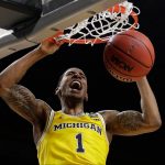 Michigan's Charles Matthews (1) dunks during the second half in the semifinals of the Final Four NCAA college basketball tournament against Loyola-Chicago, Saturday, March 31, 2018, in San Antonio. (AP Photo/David J. Phillip)