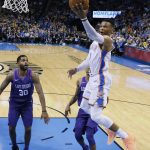 Oklahoma City Thunder guard Russell Westbrook, right, shoots in front of Phoenix Suns guard Troy Daniels (30) during the second half of an NBA basketball game in Oklahoma City, Thursday, March 8, 2018. (AP Photo/Sue Ogrocki)