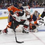 Arizona Coyotes' Brad Richardson (15) and Edmonton Oilers' Connor McDavid (97) battle for the puck during first period NHL hockey action in Edmonton, Alberta, Monday, March 5, 2018. (Jason Franson/The Canadian Press via AP)