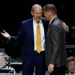 Michigan head coach John Beilein, left, and Loyola-Chicago head coach Porter Moser greet each other before the semifinals of the Final Four NCAA college basketball tournament, Saturday, March 31, 2018, in San Antonio. (AP Photo/Brynn Anderson)