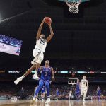 Villanova's Mikal Bridges (25) goes up for a shot against Kansas's Lagerald Vick (2) during the second half in the semifinals of the Final Four NCAA college basketball tournament, Saturday, March 31, 2018, in San Antonio. (AP Photo/Chris Steppig, NCAA Photos Pool)