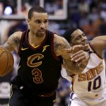 Cleveland Cavaliers guard George Hill (3) drives on Phoenix Suns guard Shaquille Harrison in the first half during an NBA basketball game, Tuesday, March 13, 2018, in Phoenix. (AP Photo/Rick Scuteri)