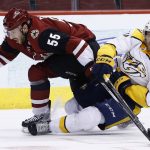 Arizona Coyotes defenseman Jason Demers (55) and Nashville Predators right wing Miikka Salomaki (20) become entangled during the first period of an NHL hockey game Thursday, March 15, 2018, in Glendale, Ariz. (AP Photo/Ross D. Franklin)