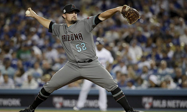 Arizona Diamondbacks pitcher Zack Godley throws to a Los Angeles Dodgers batter during the second i...