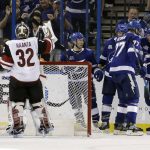Tampa Bay Lightning right wing Nikita Kucherov (86) celebrates with teammates, including defenseman Victor Hedman (77), after scoring against Arizona Coyotes goaltender Antti Raanta (32) during the third period of an NHL hockey game Monday, March 26, 2018, in Tampa, Fla. (AP Photo/Chris O'Meara)