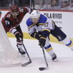 St. Louis Blues left wing Jaden Schwartz (17) shields Arizona Coyotes center Nick Cousins from the puck in the first period during an NHL hockey game, Saturday, March 31, 2018, in Glendale, Ariz. (AP Photo/Rick Scuteri)