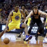 Golden State Warriors forward Kevon Looney drives to the basket past Phoenix Suns forward Alec Peters during the first half of an NBA basketball game in Phoenix, Saturday, March 17, 2018. (AP Photo/Chris Carlson)