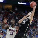 Colorado's Lucas Siewert, right, shoots while covered by Arizona's Deandre Ayton during the second half of an NCAA college basketball game in the quarterfinals of the Pac-12 men's tournament Thursday, March 8, 2018, in Las Vegas. Arizona won 83-67. (AP Photo/Isaac Brekken)