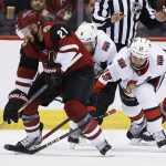 Arizona Coyotes center Derek Stepan (21) controls the puck in front of Ottawa Senators left wing Zack Smith (15) and right wing Bobby Ryan (9) as Coyotes defenseman Jason Demers (55) looks on during the second period of an NHL hockey game Saturday, March 3, 2018, in Glendale, Ariz. (AP Photo/Ross D. Franklin)