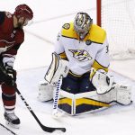 Nashville Predators goaltender Pekka Rinne, right, makes a save on a shot by Arizona Coyotes center Brad Richardson (15) during the third period of an NHL hockey game Thursday, March 15, 2018, in Glendale, Ariz. The Predators defeated the Coyotes 3-2. (AP Photo/Ross D. Franklin)