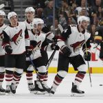 Players celebrate after Arizona Coyotes defenseman Kevin Connauton, right, scored against the Vegas Golden Knights during the second period of an NHL hockey game, Wednesday, March 28, 2018, in Las Vegas. (AP Photo/John Locher)