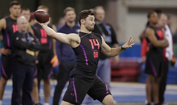 Oklahoma quarterback Baker Mayfield throws during a drill at the NFL football scouting combine in I...